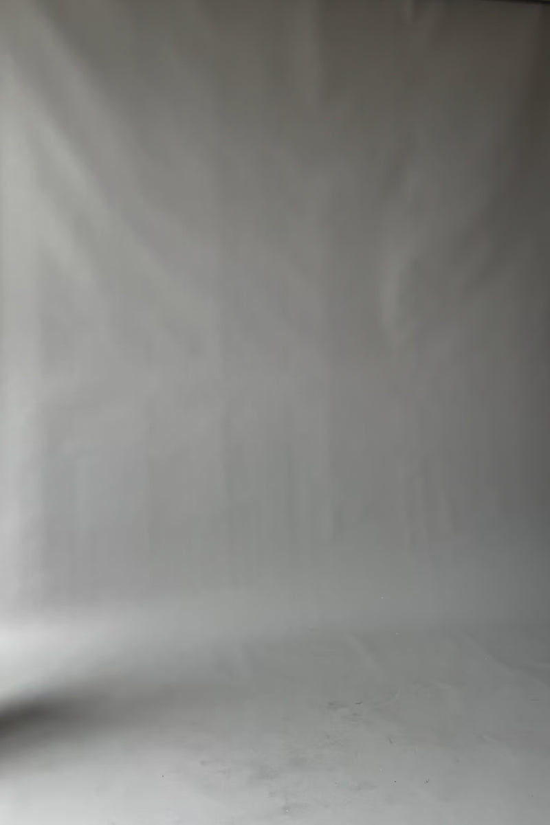 video | model walking in and out of frame showing different angles of dress |