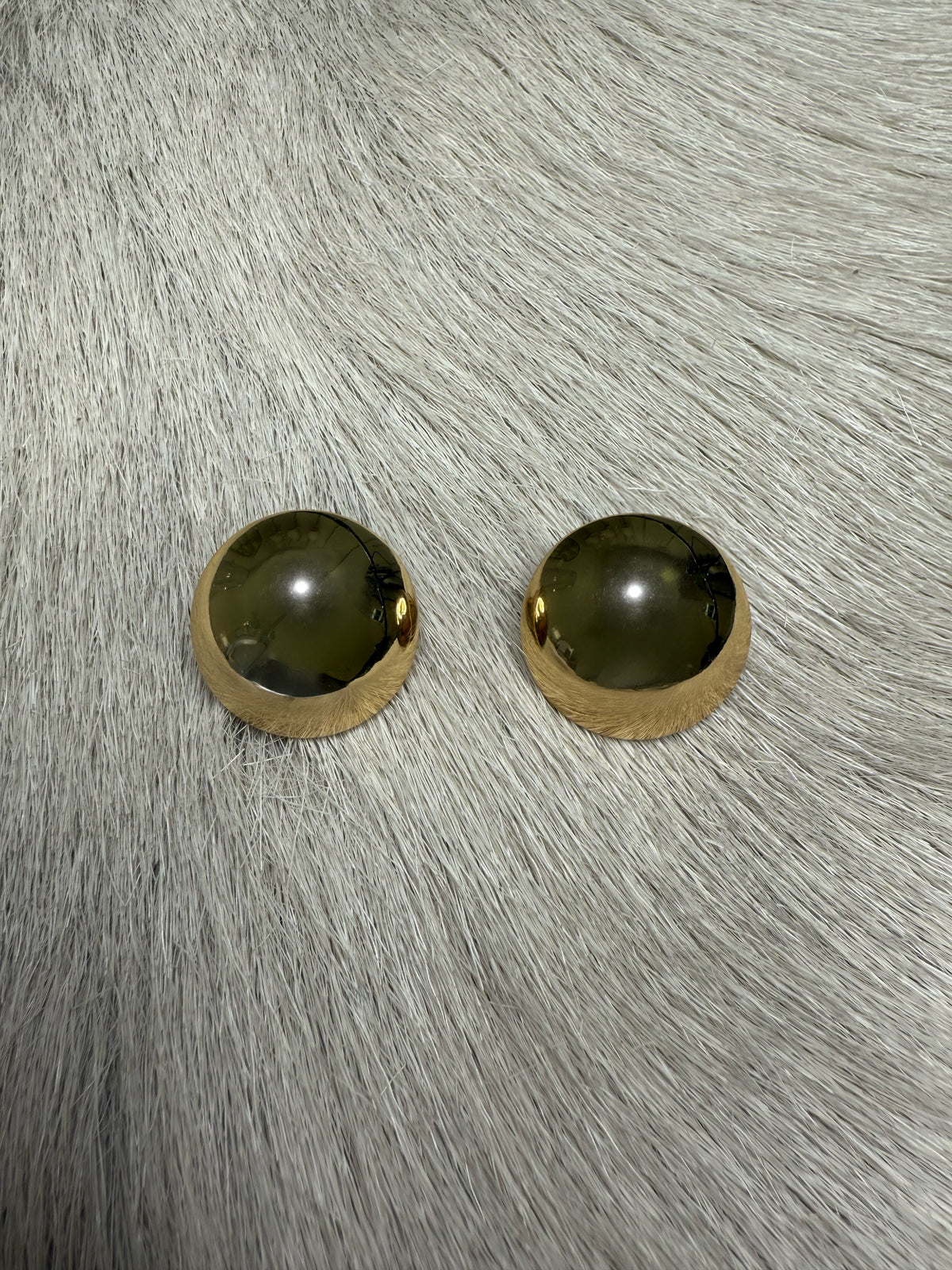 overhead-image | polished gold earrings | spherical design | top view of shiny gold spherical stud earrings