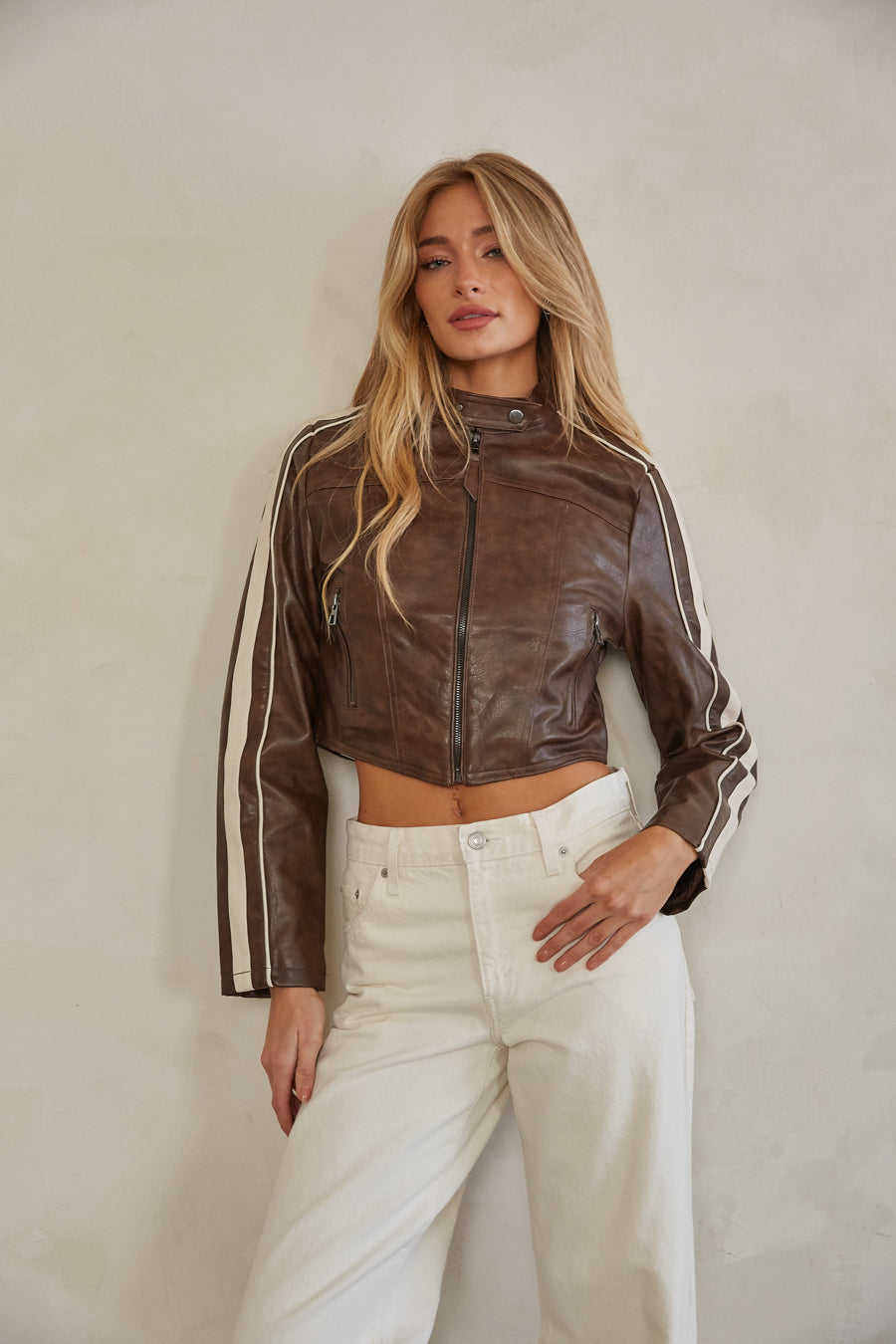 brown-image | front-image | espresso brown are striped faux leather zip up cropped jacket with bronze hardware and button top closure | sporty jacket | brown jacket | leather jacket