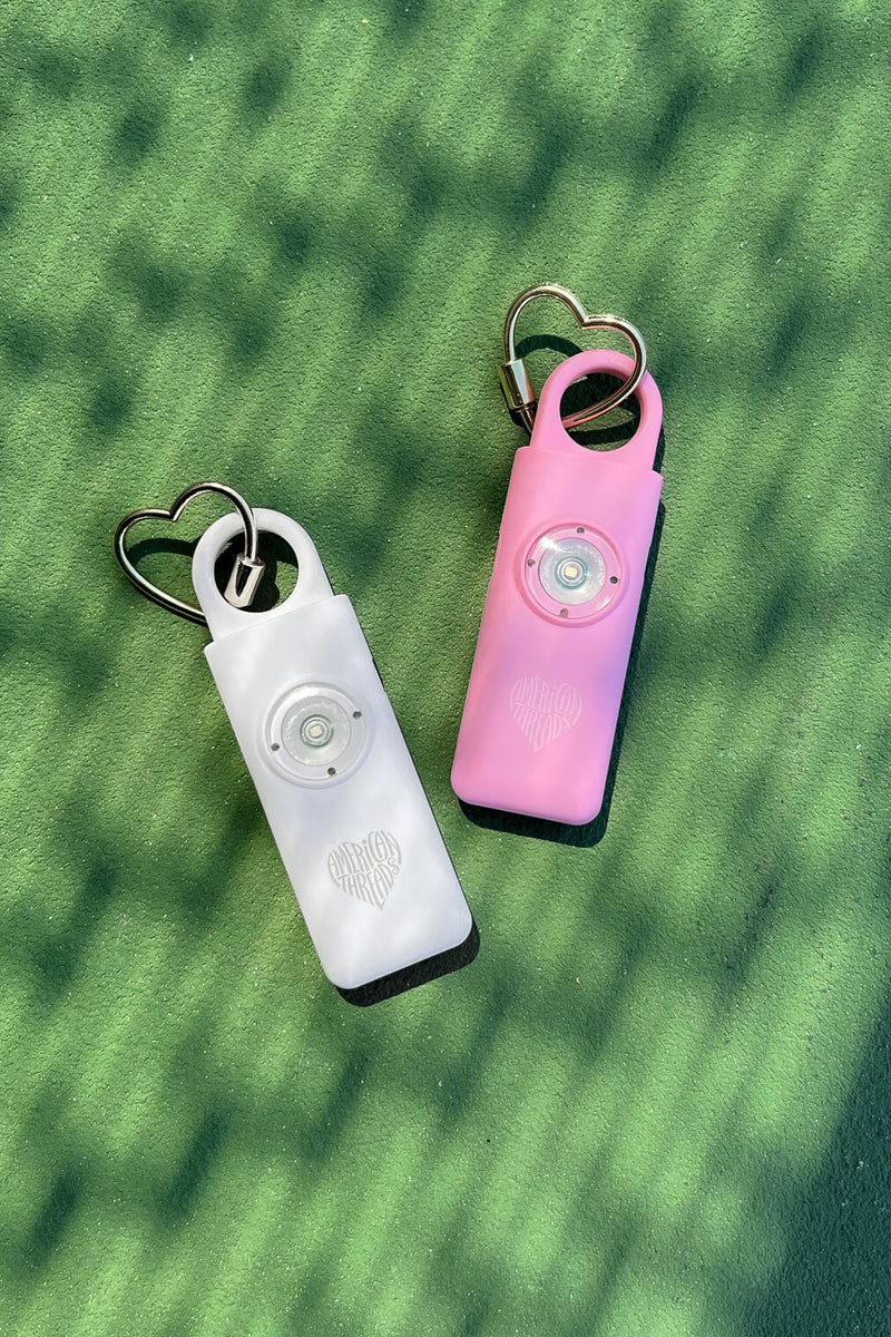 pink and white non violent personal safety devices