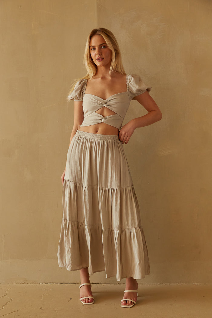  clay ivory puff sleeve keyhole front crop top and tiered maxi skirt set - top with double twist and cutout design - puff sleeve front cutout twist detailing cropped shirt