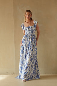 blue and white ruffle sleeve fit and flare maxi dress | wedding guest dress boutique 