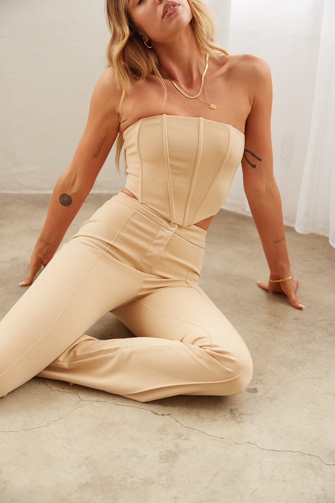 beige corset top and matching pants. 