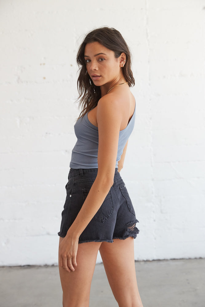 Back slit detail on the denim shorts for a cheeky look. 