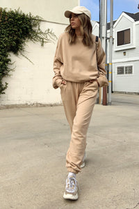 Tan crew neck sweatshirt and matching sweats.