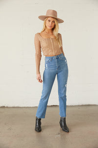 High rise jeans with subtle distressing. 