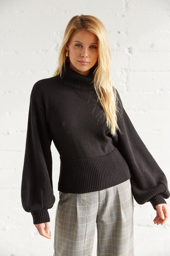 Slouchy long sleeve details and a ribbed hem. 