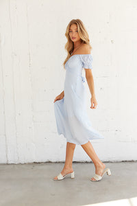 Side view of midi dress with off shoulder sleeves. 