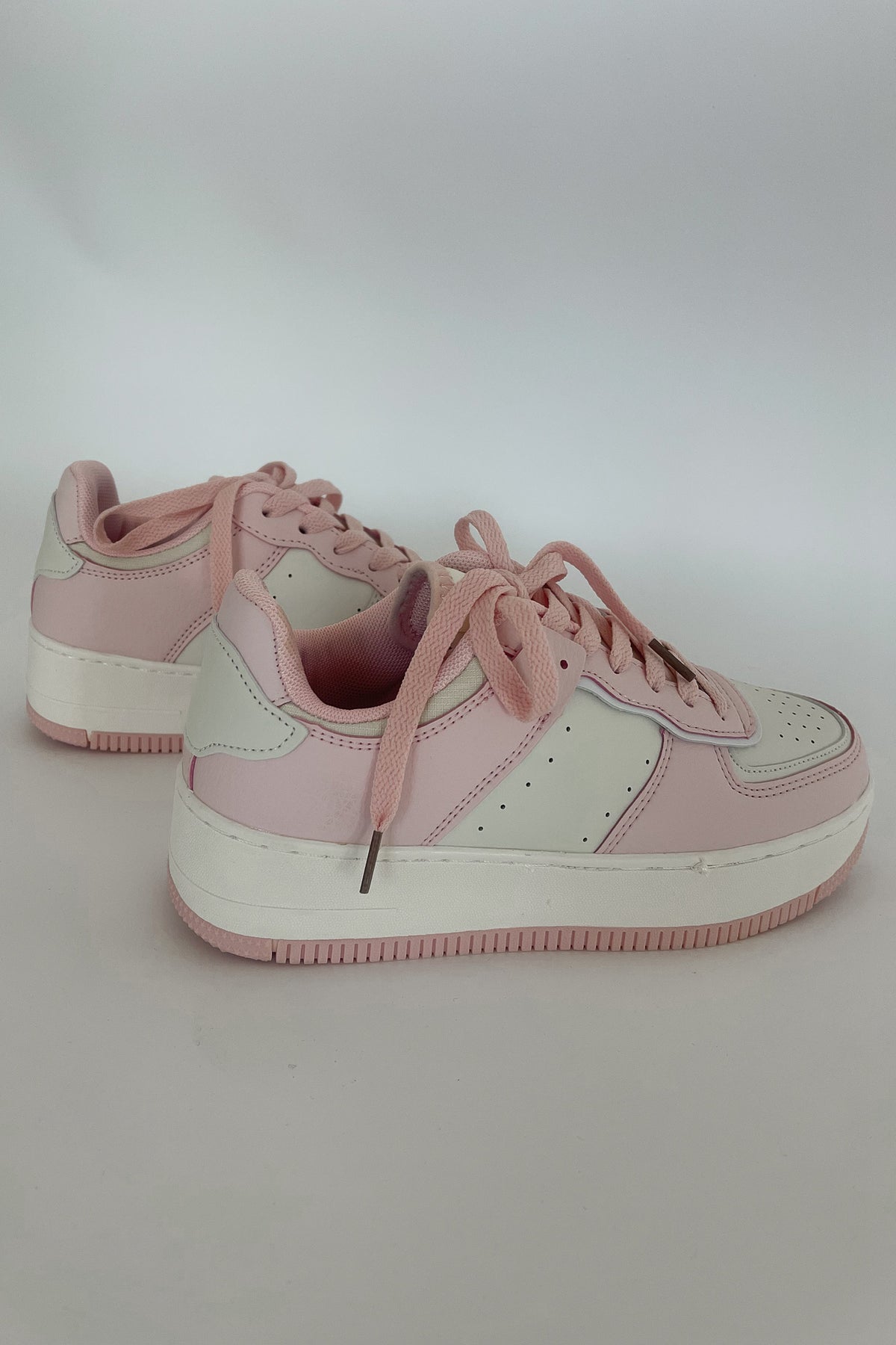 pink and white sneakers