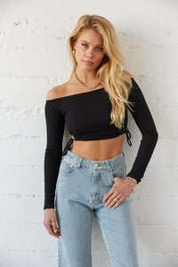 Black off shoulder crop top with side tie details.