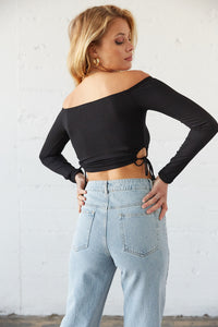 The back of this top is cropped and fitted.