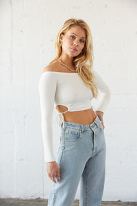 This white crop top has loop side cinch detailing.