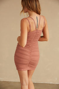 Back view of mesh cut out halter dress