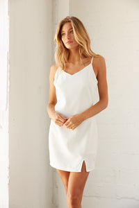 White V neck mini dress. 
