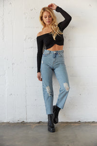 High waisted jeans in medium wash with subtle distressing. 