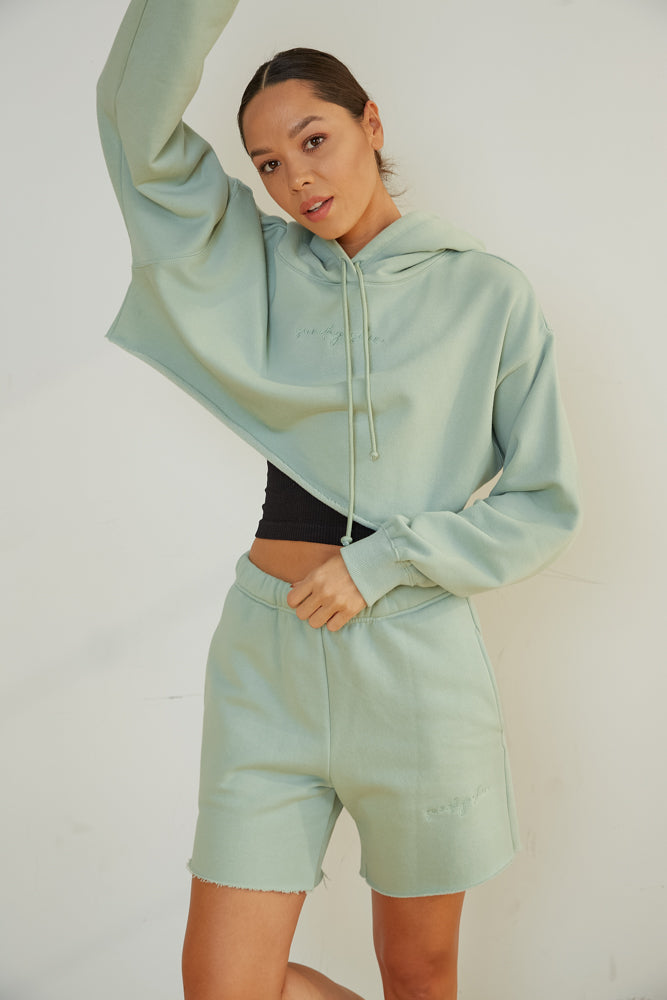 Cropped sweatshirt and lounge shorts.