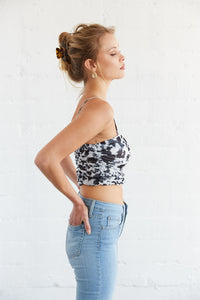 The side of this crop top is complete with a ruched design. 