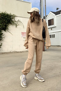 Tan oversized sweatshirt with matching high rise joggers.