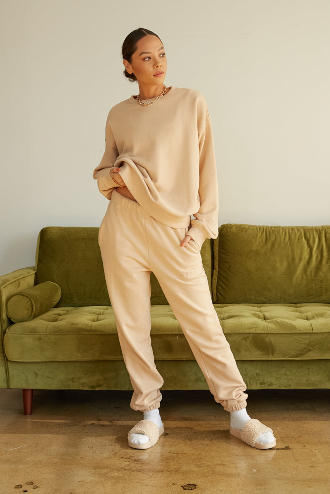 Tan sweater and matching sweatpants.