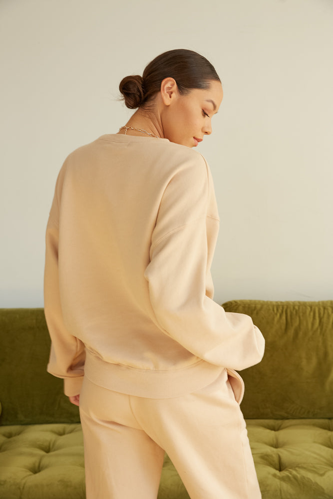 The back of this sweater is oversized.