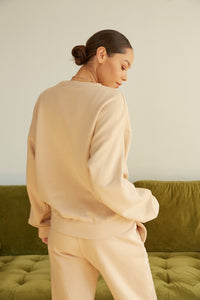 The back of this sweater is oversized.