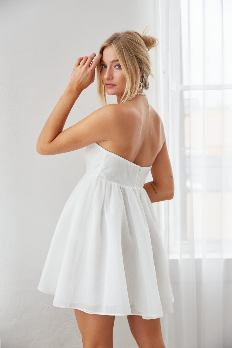 strapless white babydoll dress - little white bachelorette party dress - wedding reception outfit inspo - little white dress for bride to be