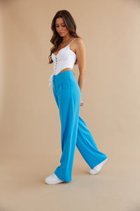 white corset and electric blue trousers