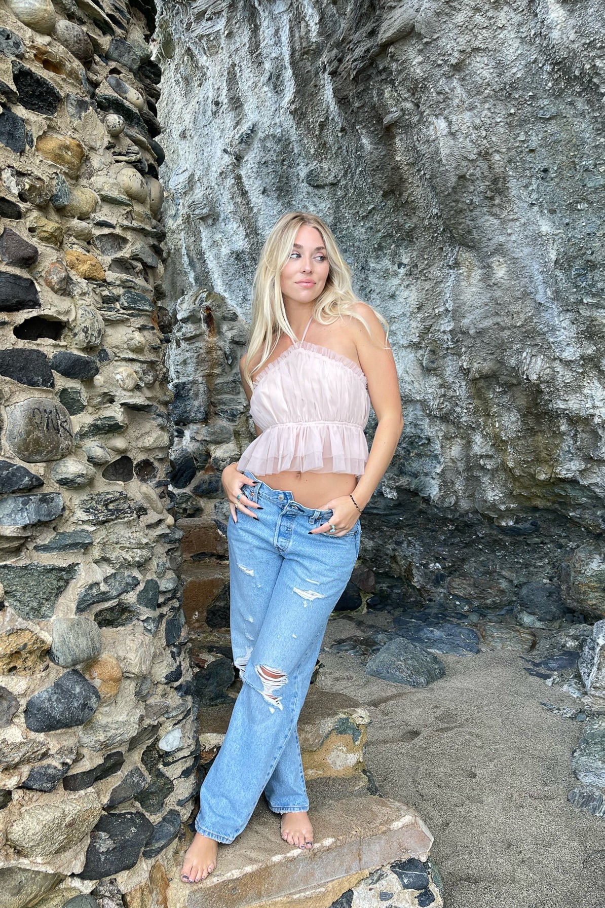 Chloe halter top complete with a peplum look- perfectly paired with jeans for a flirty casual look