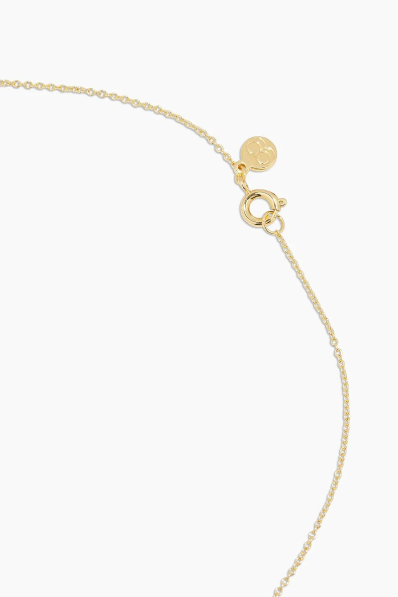 gold mini disc necklace close up