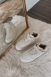 beige and white sneakers