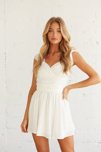 white flutter sleeve mini dress with wrap bust design - graduation dress
