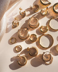 five and two gold hoop earrings 