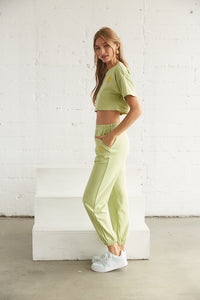Side view of green jogger sweats
