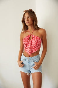 retro flower power pink crop top and cutoff levi's 501 light wash shorts
