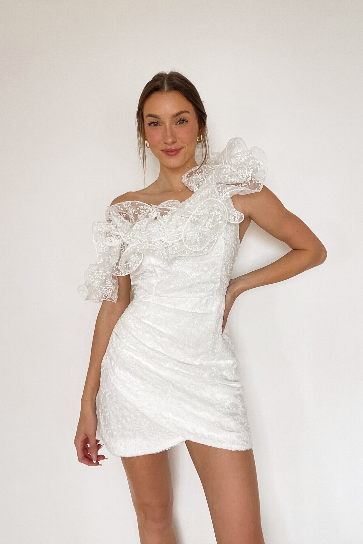white one shoulder mini dress with giant ruffle detail