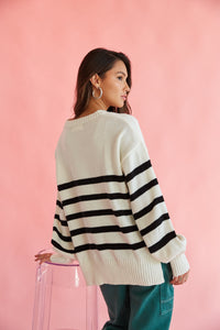 black and white striped sweater with cargo pants