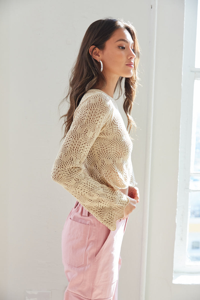 lightweight sweater with scalloped hems and bell sleeves