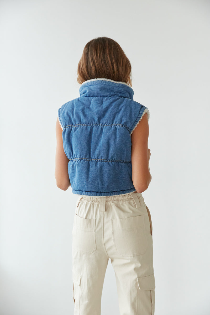 blue denim puffer vest outfit