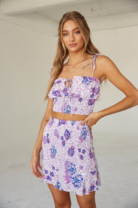 Front view of purple leopard top and skirt.