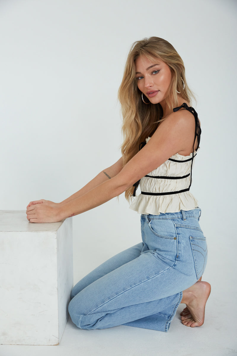 ivory contrast ruffle top - cropped ruffle contrast top - cream crop top with black ribbon details - cute crop tops for spring