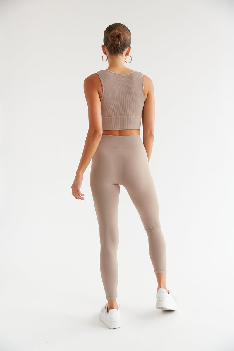 back view of stretchy taupe leggings