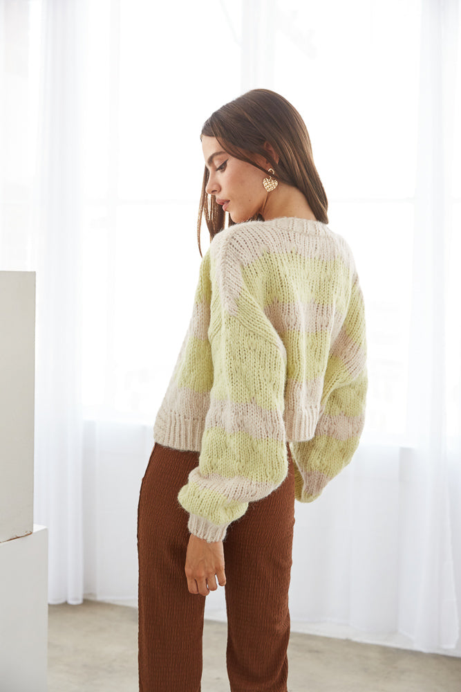 Green and beige striped sweater
