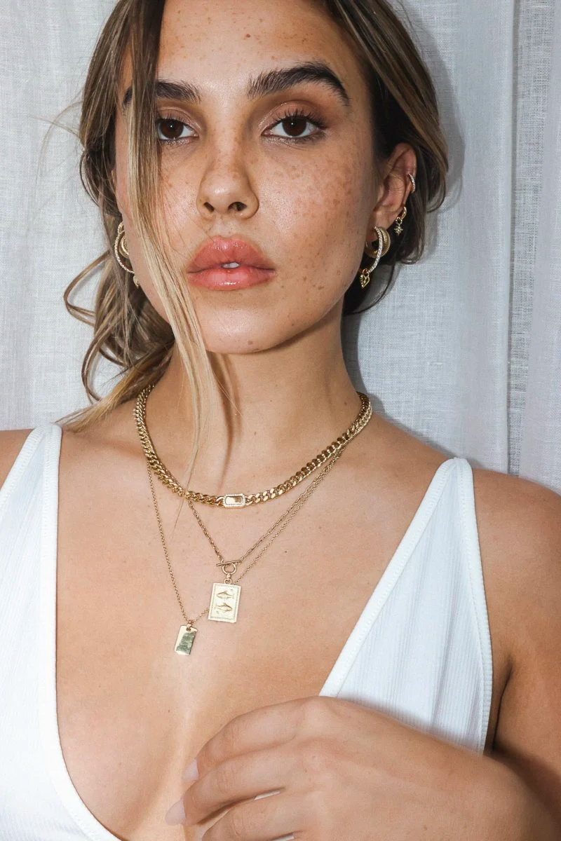 trendy layered gold jewelry by Two And Five